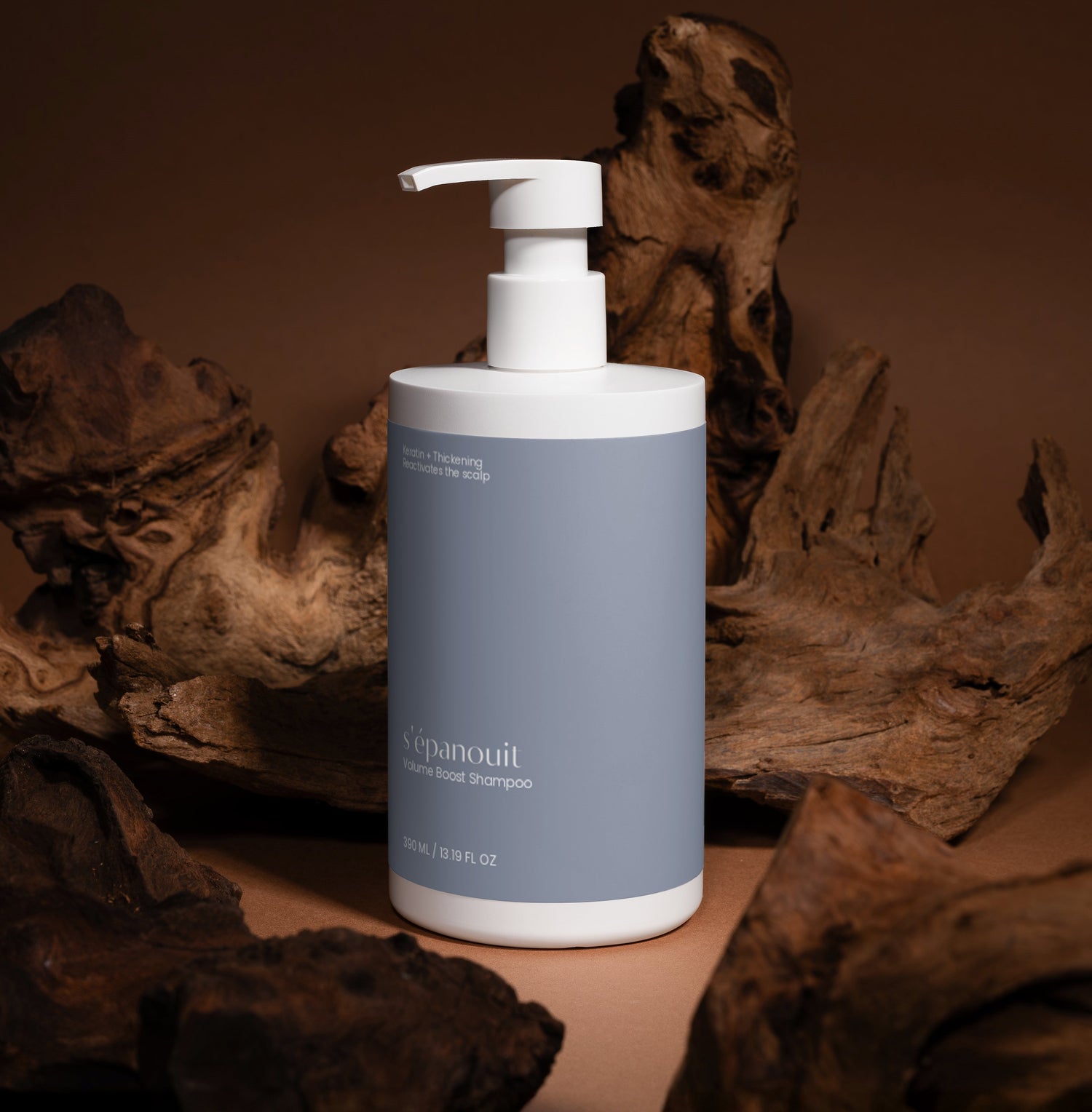 Shampoo bottle with pump dispenser on a brown background